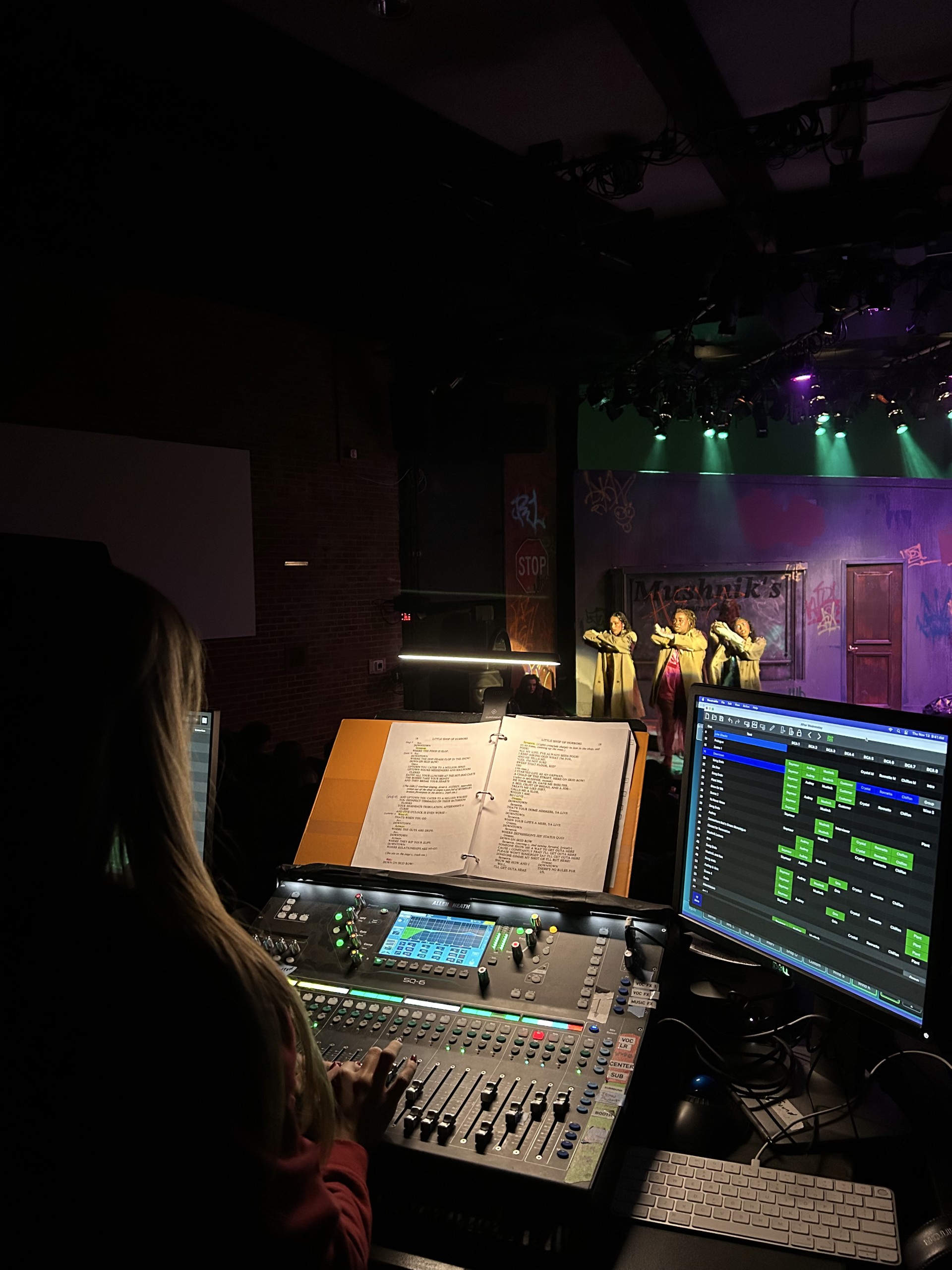 Raven Flaig at the sound board during a live production